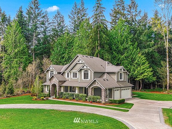 The circular drive with impressive street scape and side load 3 car garage leads to this 4950* sq ft home built in 2019.