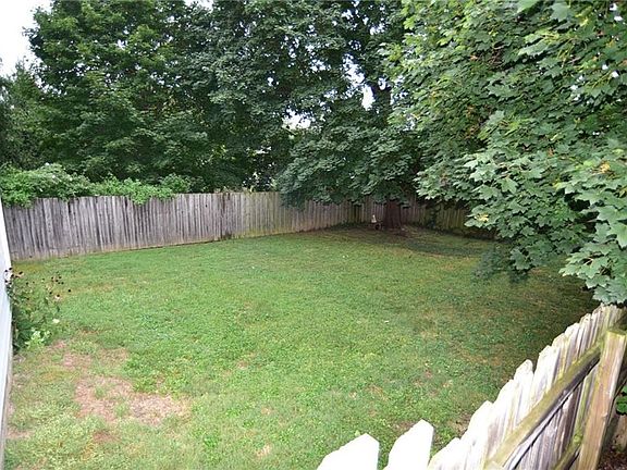 Large backyard with full privacy fence.