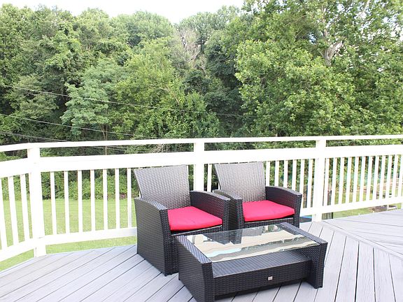 View from deck onto woods and backyard