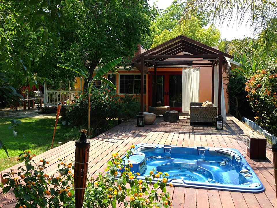 Beautiful redwood deck, french doors lead to master bedroom