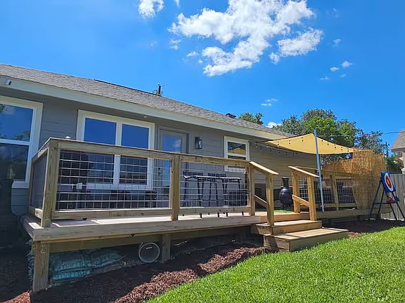 Extended deck with hot tub.