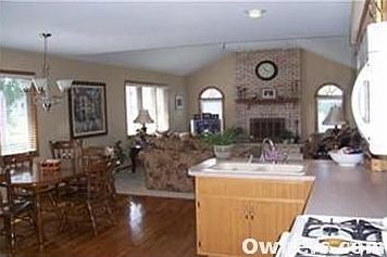 Vaulted ceilings and fireplace in living room