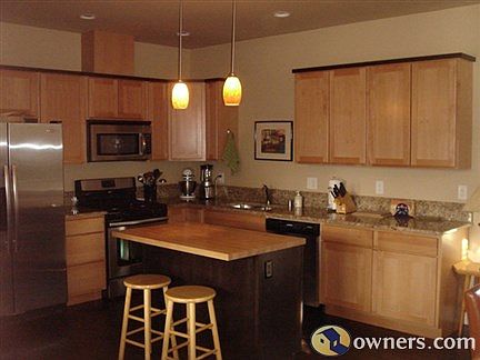 Kitchen open to dining and living areas