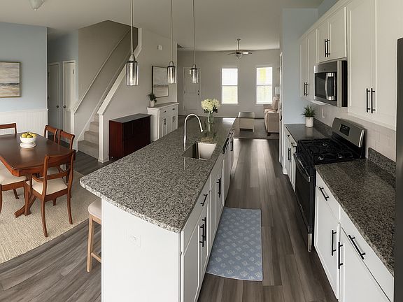 Kitchen/Dining with front TV/living room open plan.