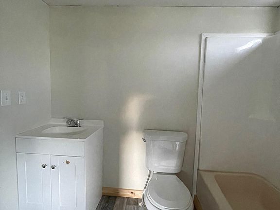 New vanities, lighting fixtures, shower surrounds and brand new toilets in bathrooms.