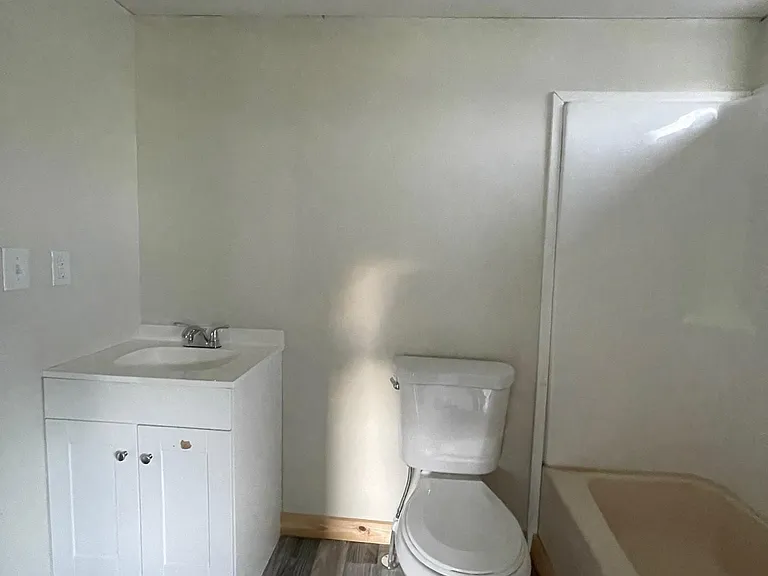 New vanities, lighting fixtures, shower surrounds and brand new toilets in bathrooms.