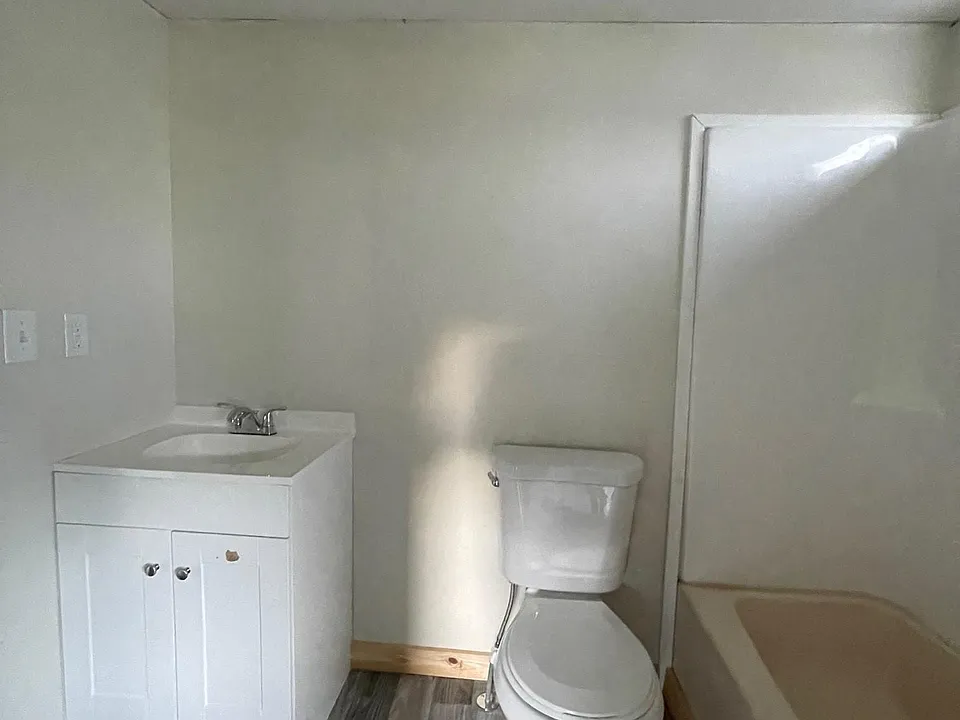 New vanities, lighting fixtures, shower surrounds and brand new toilets in bathrooms.
