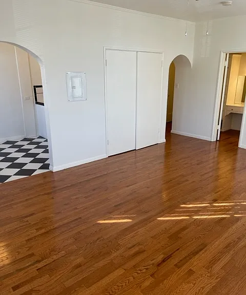 203 Main room lookin into kitchen/dining, entry hall and bathroom area
