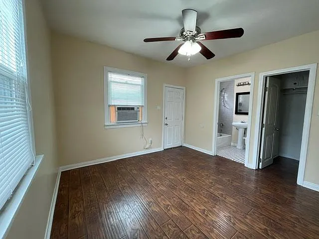 Bedroom with view of bathroom and closet