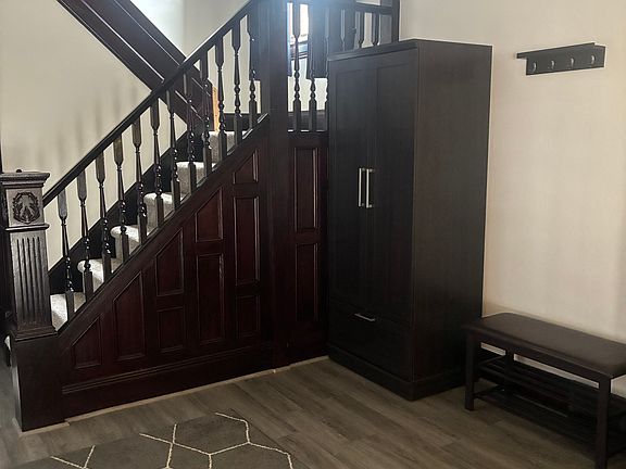 Entrance - Foyer with cabinets and bench