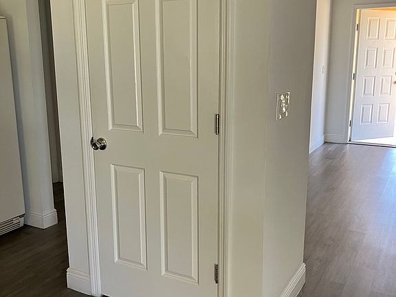 Full closet kitchen pantry which also shields kitchen area from front entry.