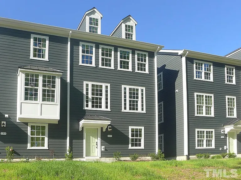 Front facing .. view opens to lush green trees and a pond