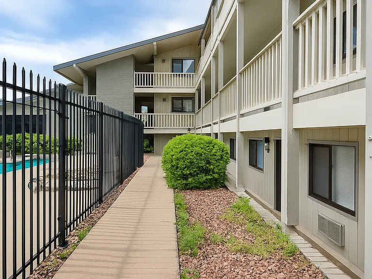 This well-kept condo complex offers a peaceful setting with easy access to amenities.