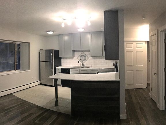 The units might have different appliance color depending on what we can provide. There is also a cabinet above refrigerator. Cabinets might be grey or brown, upper cabinets might be 36 inch height or 42 inch.