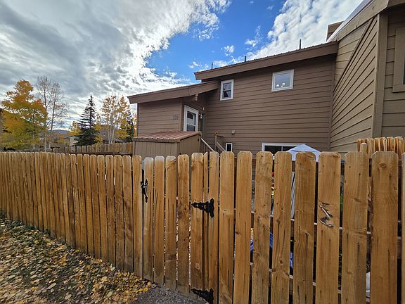 exterior front with fenced in yard and storage shed