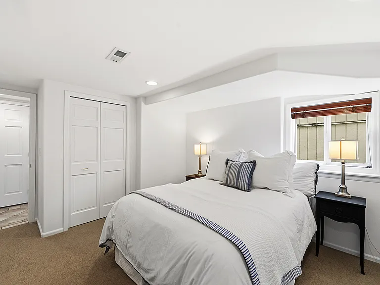 Bedroom 4 with custom closet system is adjacent to hall bath for an ensuite situation.