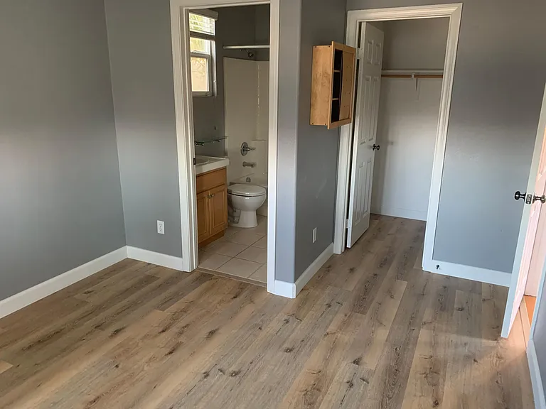 bedroom 2. new floor. walk in closet straight ahead.
