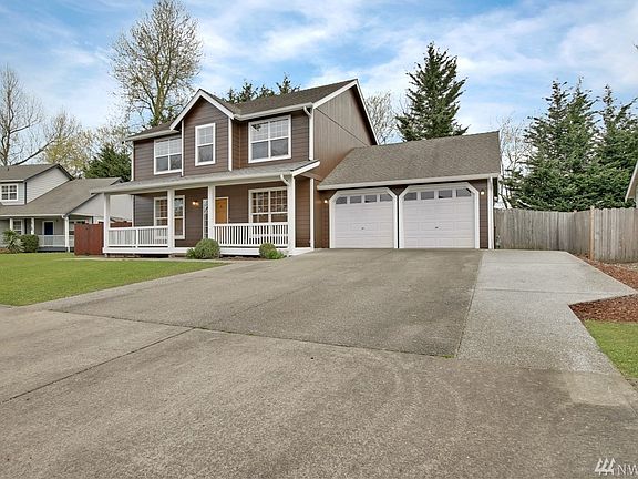 Extra wide driveway offers expansive parking