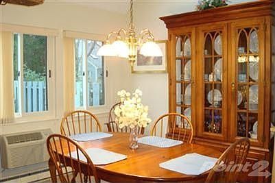 The diningroom offers ambiance with gleaming sunlight.