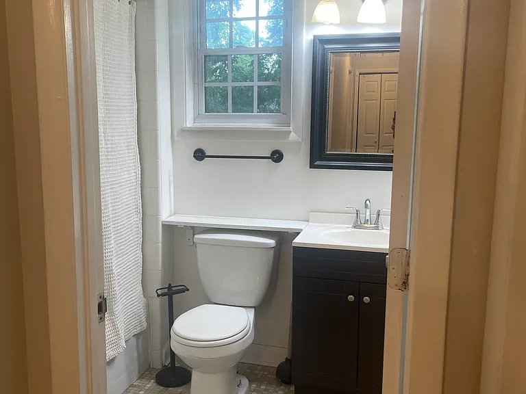 Full bath with shower and tub combo.