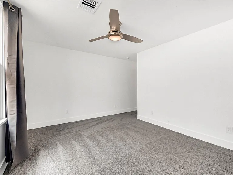 129 E 31st 1/2 St — Photo 15