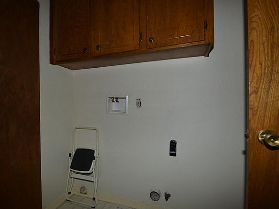 Utility room is inside the house.