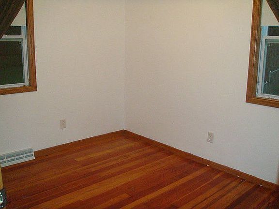 a bedroom - hard wood floors