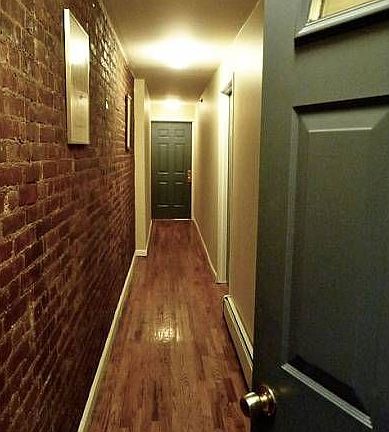 Exposed Brick Hall to Apt
