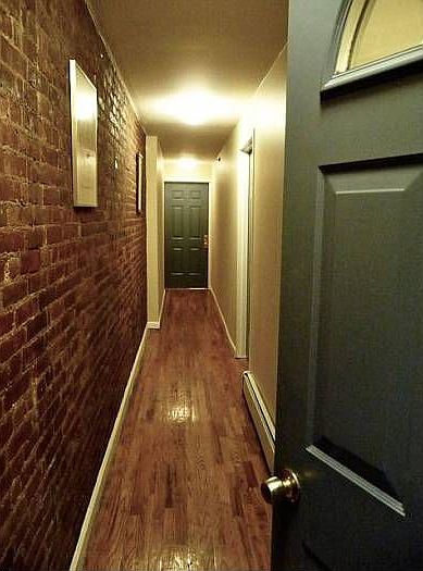 Exposed Brick Hall to Apt