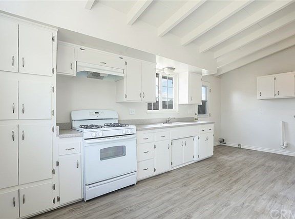 Kitchen, laundry area and side yard door