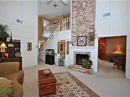 Dramatic Fireplace Draws Your Eye To The Bright &amp; Airy Living Room As You Enter. Room Enough For