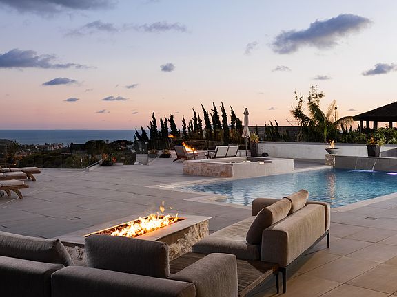 Multiple Fire pits huge entertainment spaces, pool, spa, BBQ bar area, outdoor shower and separate pool bath with shower.