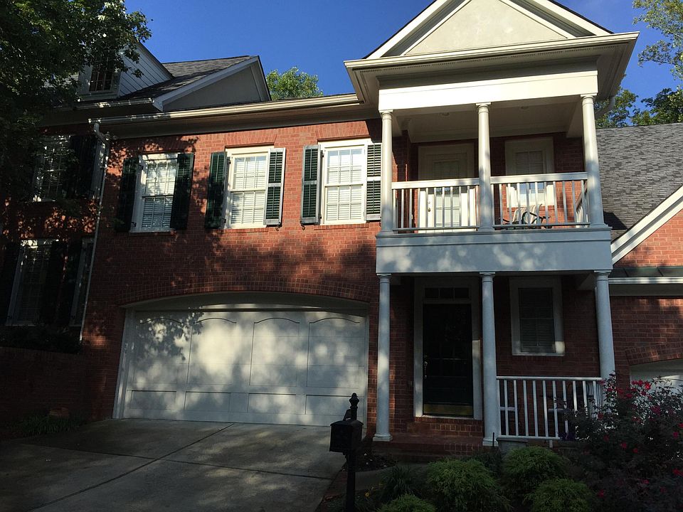 Covered front porch and walk-out balcony above