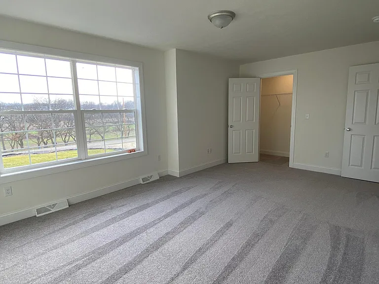 Master Bedroom with closet and large double window