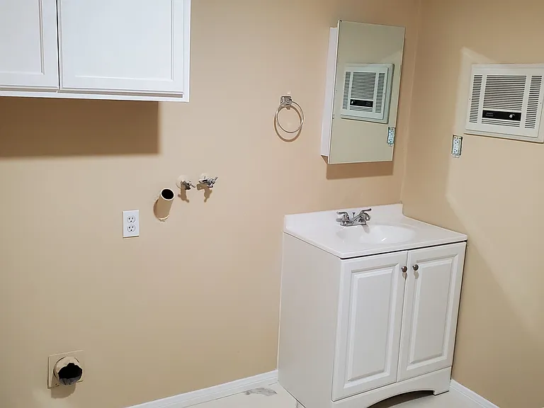 Master bathroom sink, storage, washer/dryer hook-up