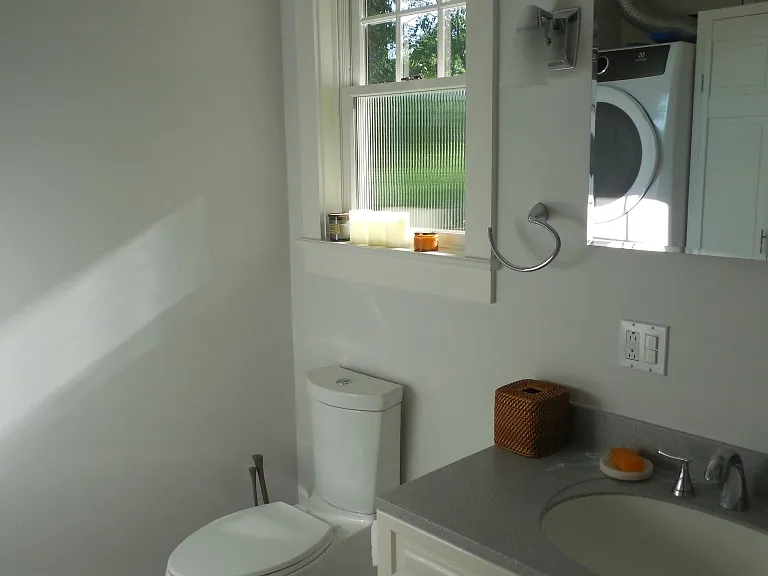 Full bathroom on main level with washer and dryer.