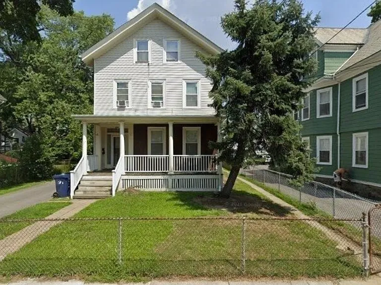 Exterior - private entry 2 family, unit is 2nd & 3rd floors. Parking in back