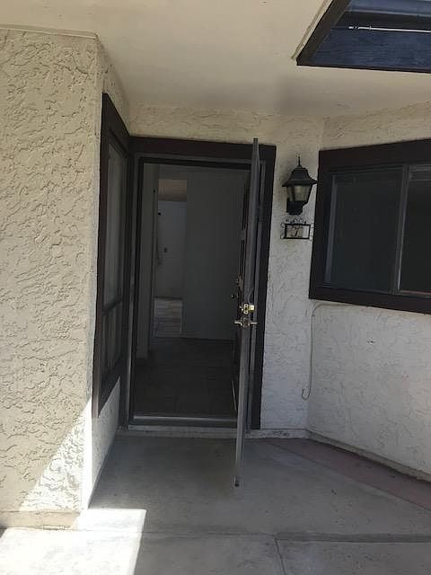 Front door through carport