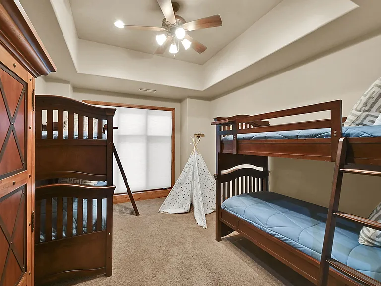 Bunk room with two bunk beds with twin mattresses