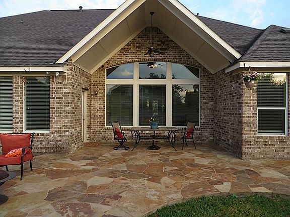 Covered Flagstone Patio in Back Yard.