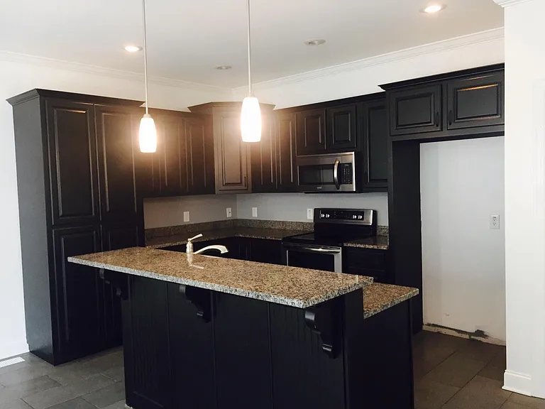 Kitchen with granite and stainless appliances