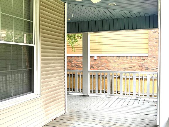 Spacious wrap front porch to enjoy the nice evenings. Gorgeous gray/blue porch ceiling that always deters mosquitos.