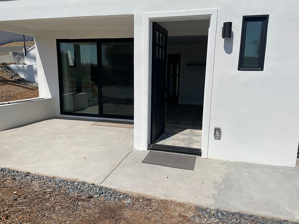 Front door and sliding doors to patio.