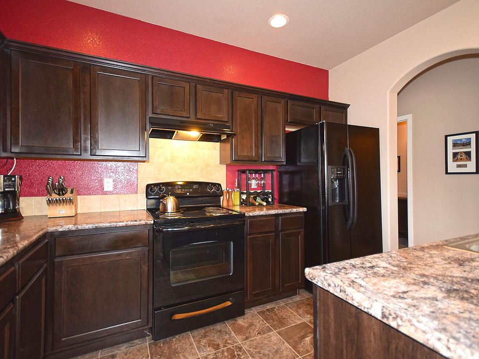 Beautiful dark wood cabinets in kitchen. All appliances included!