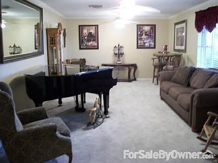 Den
						:
						This is first room as entered through front door.