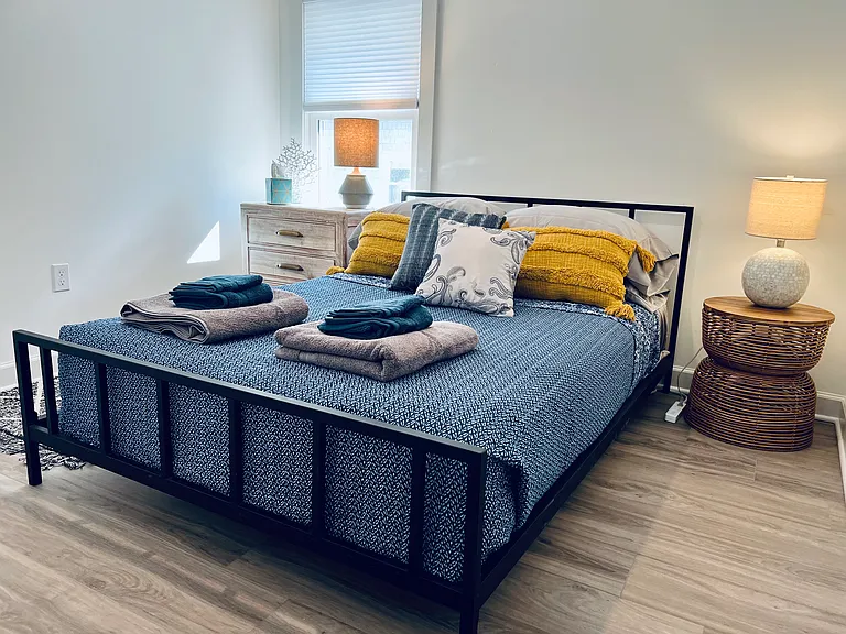 Stylish Second bedroom with full closet, 
Full size bed, dresser and end table.