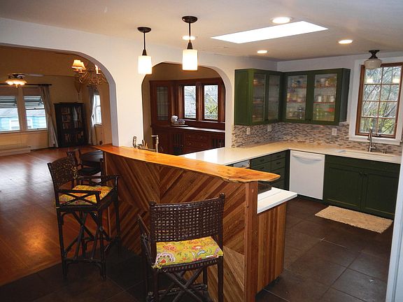 custom breakfast bar in kitchen, open to dining and living r