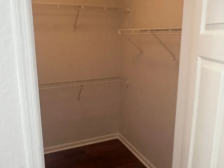 Walk-in closet or dressing room adjacent to master bedroom.
