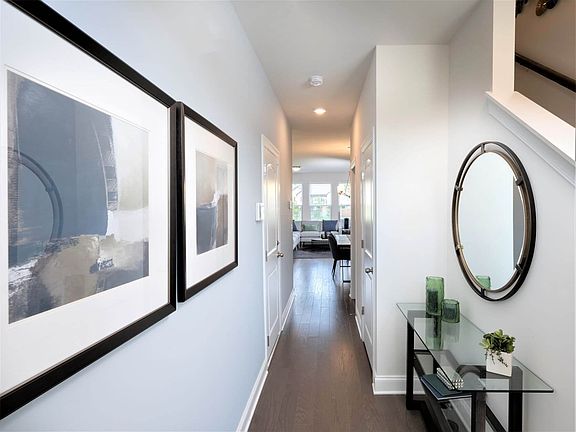 Stairs off of the foyer lead to bedrooms upstairs.