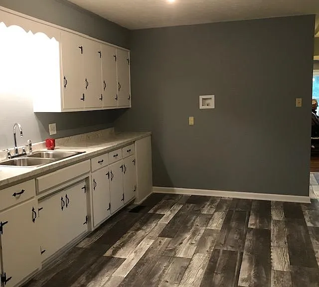 Kitchen. Refrigerator space with new water line on wall for ice maker.